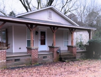 This spacious and charming 4 Bedroom 2 Bath home sits on just on Camden Country Club in Arkansas - for sale on GolfHomes.com, golf home, golf lot