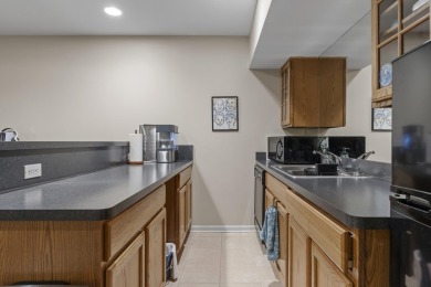Discover your dream ranch condo on the Glacier Bay Golf course on The Glacier Club in Michigan - for sale on GolfHomes.com, golf home, golf lot