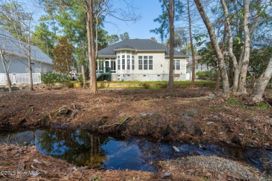 Discover this exquisite home in the coveted Arbor Creek on Players Club At St. James Plantation in North Carolina - for sale on GolfHomes.com, golf home, golf lot