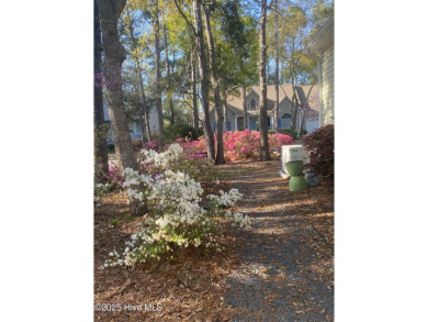 Discover this exquisite home in the coveted Arbor Creek on Players Club At St. James Plantation in North Carolina - for sale on GolfHomes.com, golf home, golf lot