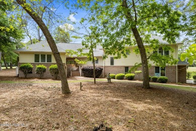Motivated sellers! This unique, custom-built home rests on on Lockwood Folly Country Club in North Carolina - for sale on GolfHomes.com, golf home, golf lot