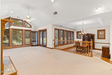 This unique, custom-built home rests on nearly  3/4  of an acre on Lockwood Folly Country Club in North Carolina - for sale on GolfHomes.com, golf home, golf lot