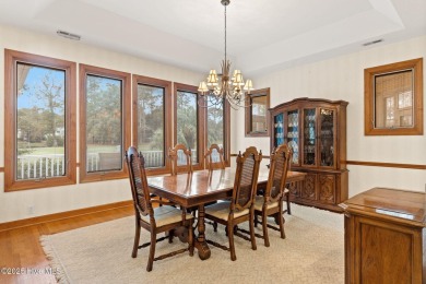 This unique, custom-built home rests on nearly  3/4  of an acre on Lockwood Folly Country Club in North Carolina - for sale on GolfHomes.com, golf home, golf lot