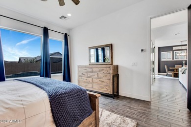 Tucked within the exclusive gated community of Verrado Highlands on Verrado Golf Club - Victory in Arizona - for sale on GolfHomes.com, golf home, golf lot