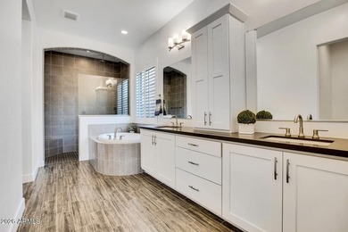 Tucked within the exclusive gated community of Verrado Highlands on Verrado Golf Club - Victory in Arizona - for sale on GolfHomes.com, golf home, golf lot