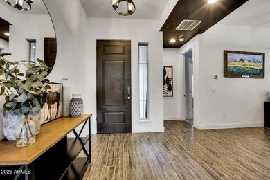 Tucked within the exclusive gated community of Verrado Highlands on Verrado Golf Club - Victory in Arizona - for sale on GolfHomes.com, golf home, golf lot