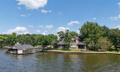 Set on a wide cove with open water views in the prestigious for sale on GolfHomes.com