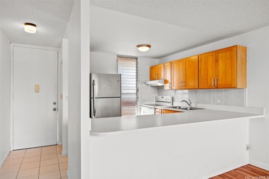 Enjoy golf course views from this centrally located 2-bedroom on Honolulu Country Club in Hawaii - for sale on GolfHomes.com, golf home, golf lot