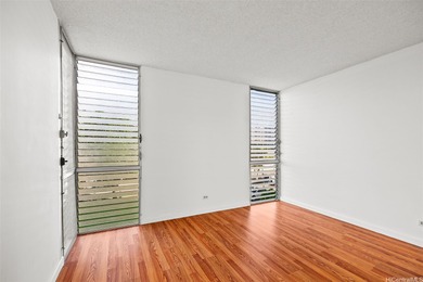 Enjoy golf course views from this centrally located 2-bedroom on Honolulu Country Club in Hawaii - for sale on GolfHomes.com, golf home, golf lot