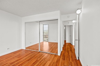 Enjoy golf course views from this centrally located 2-bedroom on Honolulu Country Club in Hawaii - for sale on GolfHomes.com, golf home, golf lot