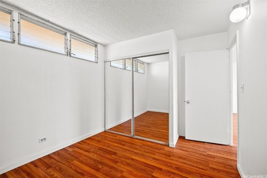 Enjoy golf course views from this centrally located 2-bedroom on Honolulu Country Club in Hawaii - for sale on GolfHomes.com, golf home, golf lot