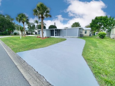 Remodeled Double-Wide manufactured home located in one of the on Barefoot Bay Golf Course in Florida - for sale on GolfHomes.com, golf home, golf lot