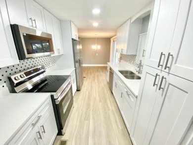 Remodeled Double-Wide manufactured home located in one of the on Barefoot Bay Golf Course in Florida - for sale on GolfHomes.com, golf home, golf lot