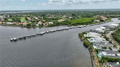 Enjoy serene waterfront views and beautiful sunsets from this on Palm Cove Golf and Yacht Club in Florida - for sale on GolfHomes.com, golf home, golf lot