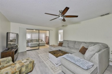 MOVE-IN READY and beautifully updated 2 bedroom, 2 bath expanded on Falcon Watch Golf Club in Florida - for sale on GolfHomes.com, golf home, golf lot