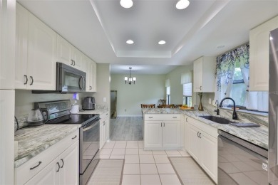 MOVE-IN READY and beautifully updated 2 bedroom, 2 bath expanded on Falcon Watch Golf Club in Florida - for sale on GolfHomes.com, golf home, golf lot