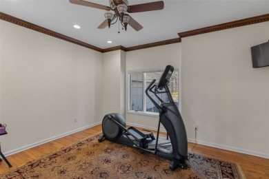 Experience serene lakefront living in this exceptional retreat on Burlingame Country Club in North Carolina - for sale on GolfHomes.com, golf home, golf lot