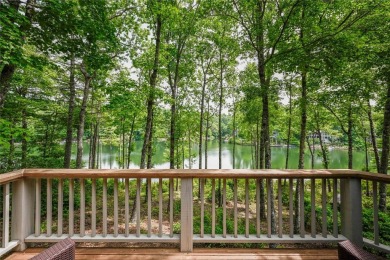 Experience serene lakefront living in this exceptional retreat on Burlingame Country Club in North Carolina - for sale on GolfHomes.com, golf home, golf lot