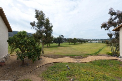 Ground-level ease, elevated living. Perfectly positioned as a on Lake San Marcos Country Club- South Course in California - for sale on GolfHomes.com, golf home, golf lot