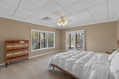 Experience serene lakefront living in this exceptional retreat on Burlingame Country Club in North Carolina - for sale on GolfHomes.com, golf home, golf lot