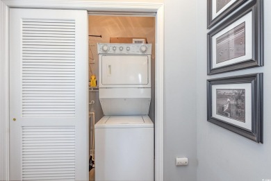 This exquisite top floor end unit is a luxurious retreat with on Barefoot Resort and Golf Club  in South Carolina - for sale on GolfHomes.com, golf home, golf lot