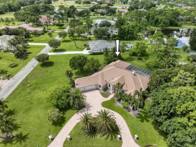 With more than 5,300 square feet under air, this Ecclestone on PGA National Estates Golf Course in Florida - for sale on GolfHomes.com, golf home, golf lot