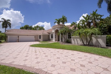 With more than 5,300 square feet under air, this Ecclestone on PGA National Estates Golf Course in Florida - for sale on GolfHomes.com, golf home, golf lot