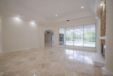 With more than 5,300 square feet under air, this Ecclestone on PGA National Estates Golf Course in Florida - for sale on GolfHomes.com, golf home, golf lot