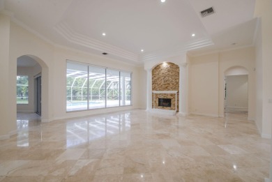 With more than 5,300 square feet under air, this Ecclestone on PGA National Estates Golf Course in Florida - for sale on GolfHomes.com, golf home, golf lot