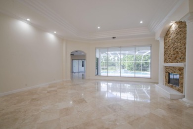 With more than 5,300 square feet under air, this Ecclestone on PGA National Estates Golf Course in Florida - for sale on GolfHomes.com, golf home, golf lot