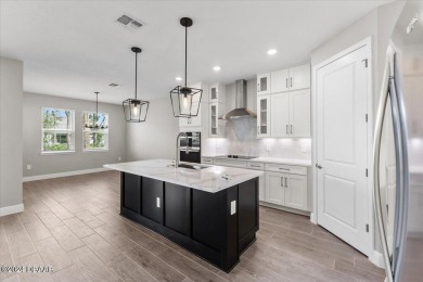 Brand new, energy-efficient home available NOW! The Peridot on LPGA International Golf Course in Florida - for sale on GolfHomes.com, golf home, golf lot