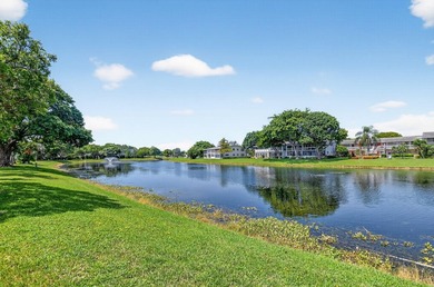 Welcome to this bright and spacious 2-bedroom, 2-bathroom on Hillsboro Pines Golf in Florida - for sale on GolfHomes.com, golf home, golf lot