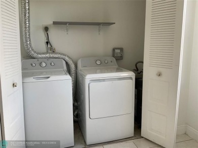 Stylish and serene 2-bedroom, 2-bathroom condo with breathtaking on Oriole Golf and Tennis Club in Florida - for sale on GolfHomes.com, golf home, golf lot