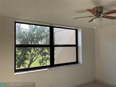 Stylish and serene 2-bedroom, 2-bathroom condo with breathtaking on Oriole Golf and Tennis Club in Florida - for sale on GolfHomes.com, golf home, golf lot