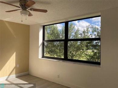 Stylish and serene 2-bedroom, 2-bathroom condo with breathtaking on Oriole Golf and Tennis Club in Florida - for sale on GolfHomes.com, golf home, golf lot