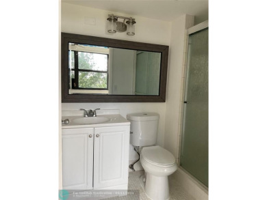 Stylish and serene 2-bedroom, 2-bathroom condo with breathtaking on Oriole Golf and Tennis Club in Florida - for sale on GolfHomes.com, golf home, golf lot