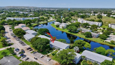 Welcome to this bright and spacious 2-bedroom, 2-bathroom on Hillsboro Pines Golf in Florida - for sale on GolfHomes.com, golf home, golf lot