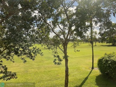 Stylish and serene 2-bedroom, 2-bathroom condo with breathtaking on Oriole Golf and Tennis Club in Florida - for sale on GolfHomes.com, golf home, golf lot