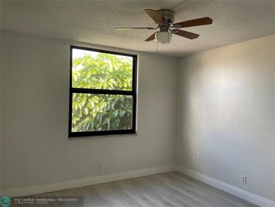 Stylish and serene 2-bedroom, 2-bathroom condo with breathtaking on Oriole Golf and Tennis Club in Florida - for sale on GolfHomes.com, golf home, golf lot