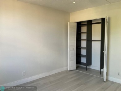 Stylish and serene 2-bedroom, 2-bathroom condo with breathtaking on Oriole Golf and Tennis Club in Florida - for sale on GolfHomes.com, golf home, golf lot