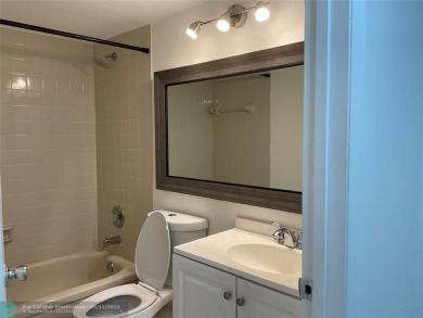 Stylish and serene 2-bedroom, 2-bathroom condo with breathtaking on Oriole Golf and Tennis Club in Florida - for sale on GolfHomes.com, golf home, golf lot