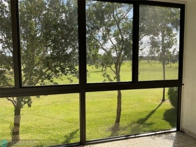 Stylish and serene 2-bedroom, 2-bathroom condo with breathtaking on Oriole Golf and Tennis Club in Florida - for sale on GolfHomes.com, golf home, golf lot