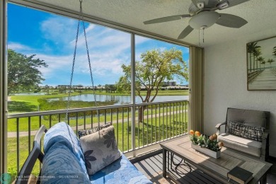 Backyard beauty! This so beautiful, light, bright condo home in on Marina Lakes Golf Course in Florida - for sale on GolfHomes.com, golf home, golf lot
