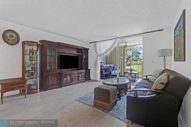 Backyard beauty! This so beautiful, light, bright condo home in on Marina Lakes Golf Course in Florida - for sale on GolfHomes.com, golf home, golf lot