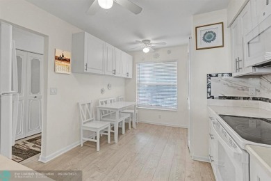 Backyard beauty! This so beautiful, light, bright condo home in on Marina Lakes Golf Course in Florida - for sale on GolfHomes.com, golf home, golf lot