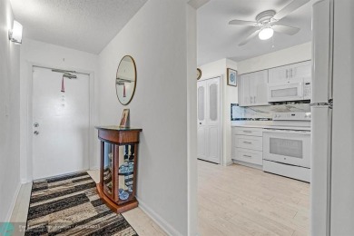 Backyard beauty! This so beautiful, light, bright condo home in on Marina Lakes Golf Course in Florida - for sale on GolfHomes.com, golf home, golf lot