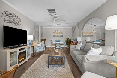 Experience the charm of coastal living in this beautifully on The Dunedin Country Club in Florida - for sale on GolfHomes.com, golf home, golf lot