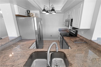 This spacious corner end unit delivers the South Florida on Hideaway Country Club in Florida - for sale on GolfHomes.com, golf home, golf lot