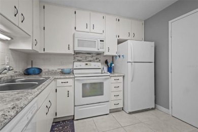 Experience the charm of coastal living in this beautifully on The Dunedin Country Club in Florida - for sale on GolfHomes.com, golf home, golf lot