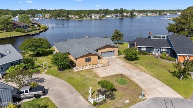 Experience unparalleled waterfront living in this waterfront on Harbour Point Golf Club in North Carolina - for sale on GolfHomes.com, golf home, golf lot